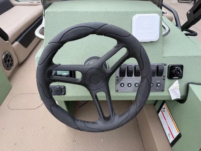 Slide: The Image of Steering wheel of 2025 SeaArk Easy 200 boat with Suzuki DF200 engine controls. - 5