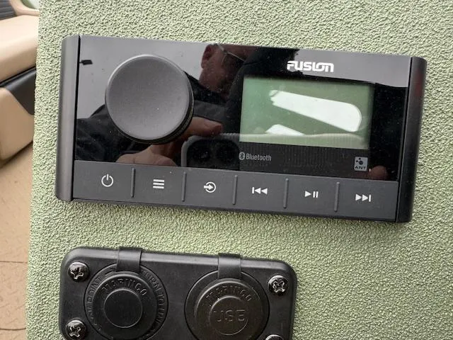 Slide: The Image of Fusion marine stereo system on SeaArk Easy 200 boat dashboard, 2025 model. - 6