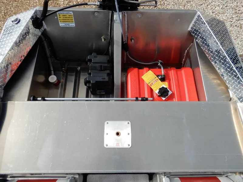 Slide: The Image of 2025 Blazer 1752 SS boat storage compartment with red fuel tank and metal finish. - 11