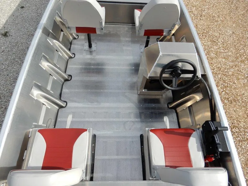 Slide: The Image of 2025 Blazer 1752 SS boat interior with red and gray seating, steering console, and aluminum flooring. - 14