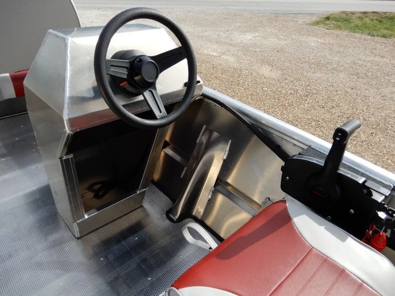 Slide: The Image of 2025 Blazer 1752 SS boat interior with steering wheel and red seats. - 16