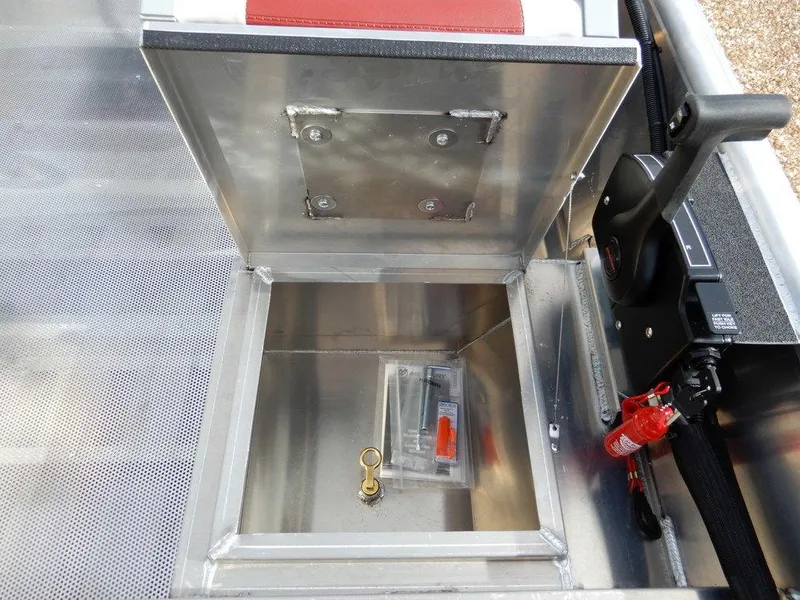 Slide: The Image of 2025 Blazer 1752 SS boat storage compartment with safety equipment and accessories. - 21