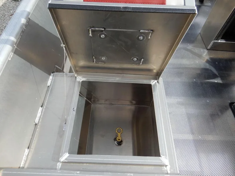 Slide: The Image of Open storage compartment of 2025 Blazer 1752 SS, showcasing stainless steel interior. - 22