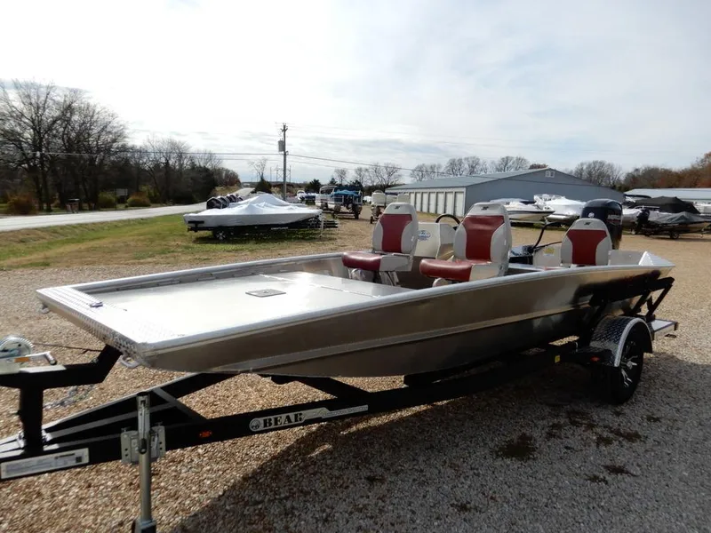Slide: The Image of 2025 Blazer 1752 SS boat on trailer, featuring red seats, parked outdoors. - 3