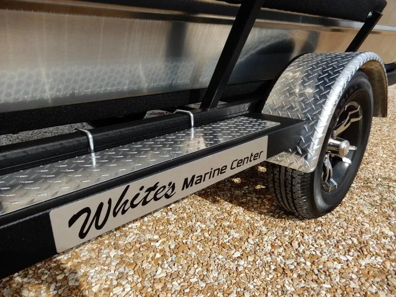 Slide: The Image of Trailer with "White's Marine Center" branding, featuring diamond plate fender, Blazer 1752 SS, 2025 model. - 31