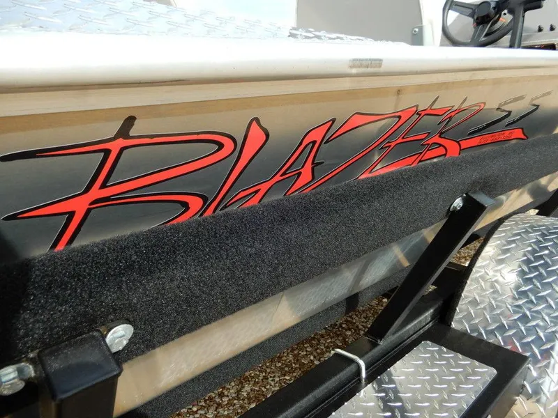 Slide: The Image of 2025 Blazer 1752 SS boat with bold red logo on the side. - 32