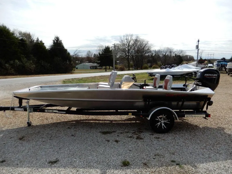 Slide: The Image of 2025 Blazer 1752 SS boat on trailer with Mercury outboard motor, parked outdoors. - 4