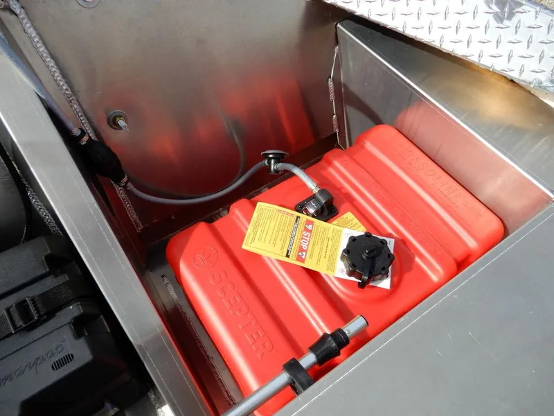 Slide: The Image of Red fuel tank in a 2025 Blazer 1752 SS boat compartment. - 13