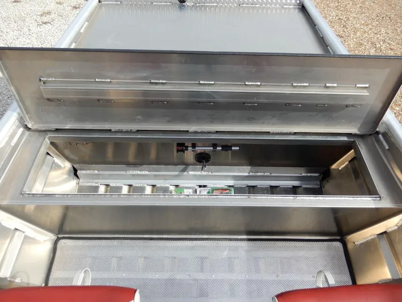 Slide: The Image of 2025 Blazer 1752 SS boat storage compartment, open lid, showcasing interior space and design. - 19