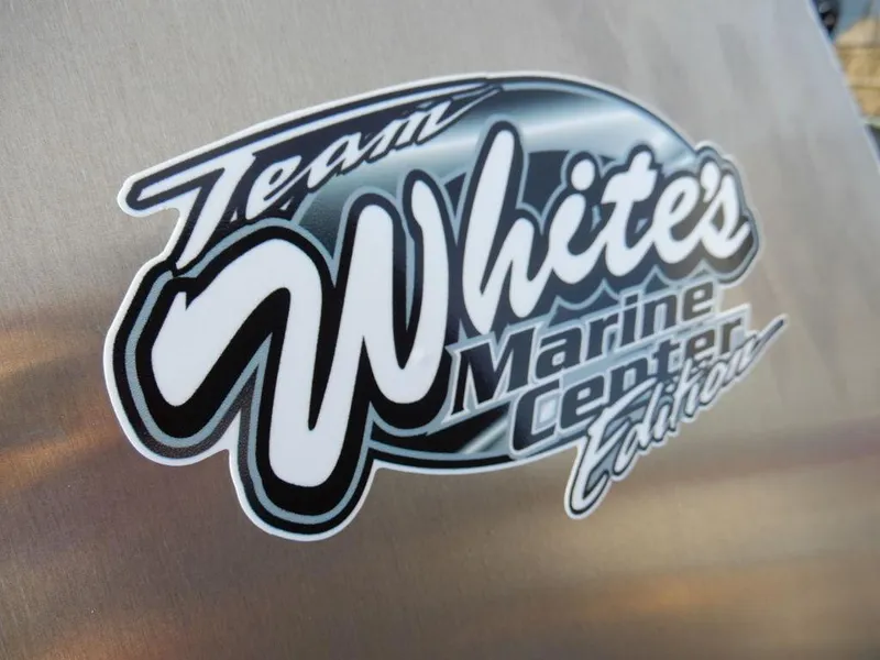 Slide: The Image of Team White's Marine Center Edition logo on 2025 Blazer 1752 SS. - 23