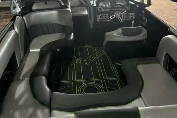 Slide: The Image of Interior of a 2017 MB B52 21 Classic boat with modern seating and dashboard. - 3