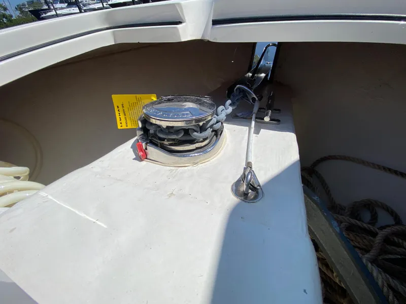Slide: The Image of 2022 Cobia 301 Center Console boat anchor system close-up. - 14