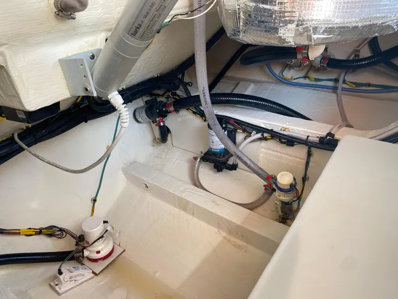 Slide: The Image of 2022 Cobia 301 Center Console boat interior wiring and plumbing details. - 33
