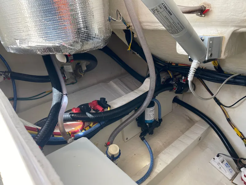 Slide: The Image of 2022 Cobia 301 Center Console boat interior wiring and components. - 34