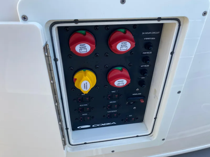 Slide: The Image of Control panel of 2022 Cobia 301 Center Console boat with labeled switches. - 8