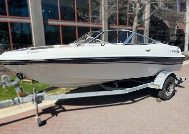 Slide: The Image of 2002 Four Winns 170 Horizon boat on trailer, parked outdoors. - 1