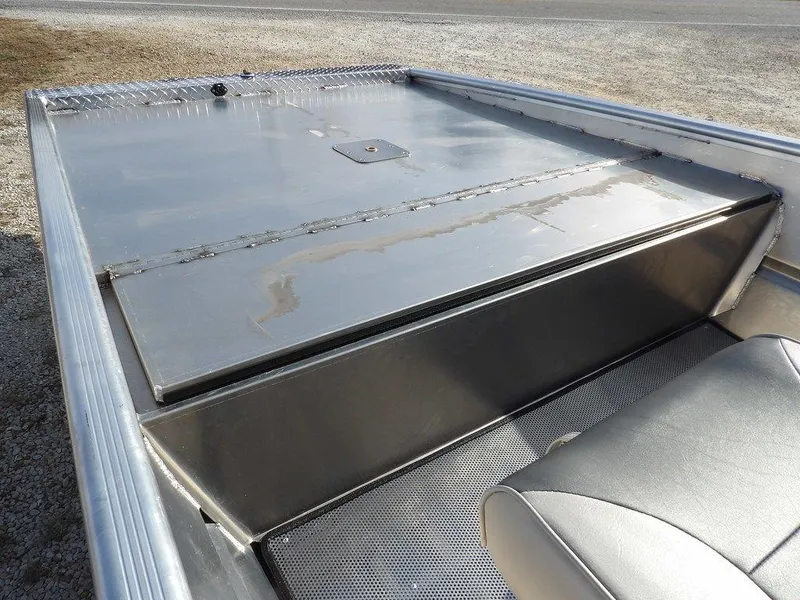 Slide: The Image of 2025 Blazer 1752 SS boat interior with metal seating and storage compartment. - 10