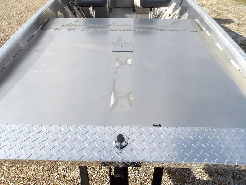 Slide: The Image of 2025 Blazer 1752 SS boat deck with diamond plate finish, showcasing sleek aluminum design. - 23