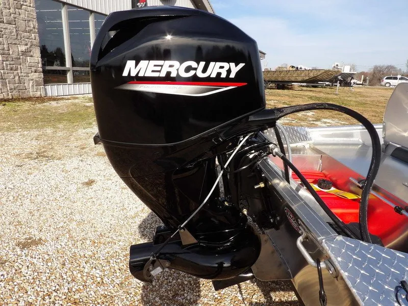 Slide: The Image of 2025 Blazer 1752 SS boat with Mercury outboard motor, parked outdoors. - 29