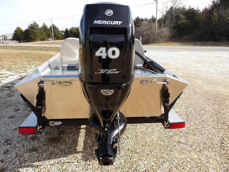 Slide: The Image of 2025 Blazer 1752 SS boat with Mercury 40 HP engine, parked on gravel. - 30