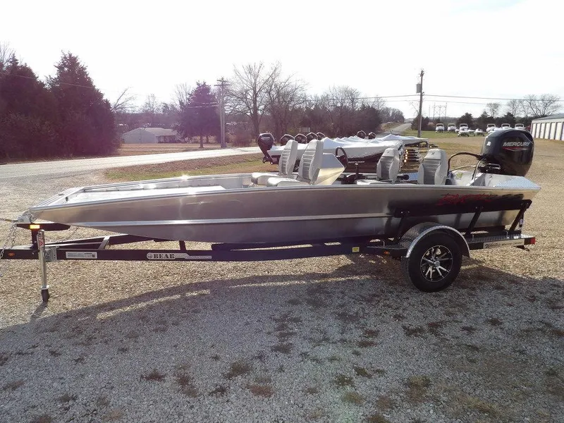 Slide: The Image of 2025 Blazer 1752 SS boat on trailer, parked outdoors, side view. - 4