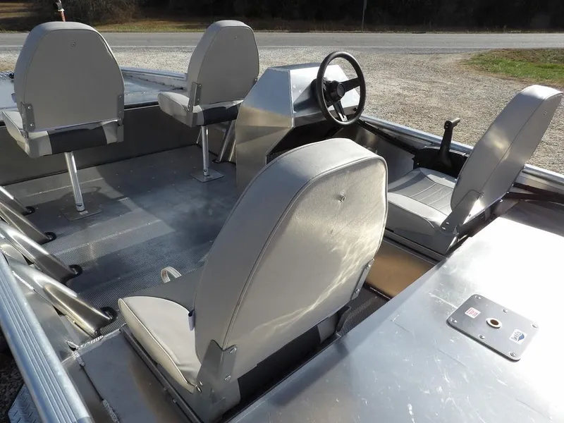 Slide: The Image of 2025 Blazer 1752 SS boat interior with gray seating and steering console. - 9