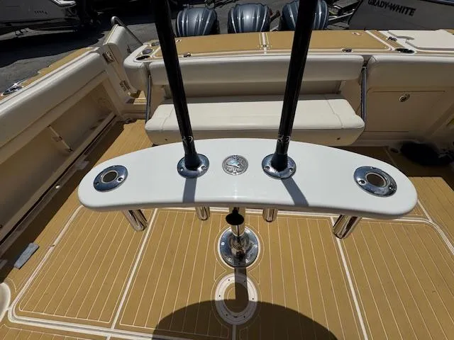 Slide: The Image of 2022 Grady-White Express 370 boat deck with rod holders and seating area. - 11