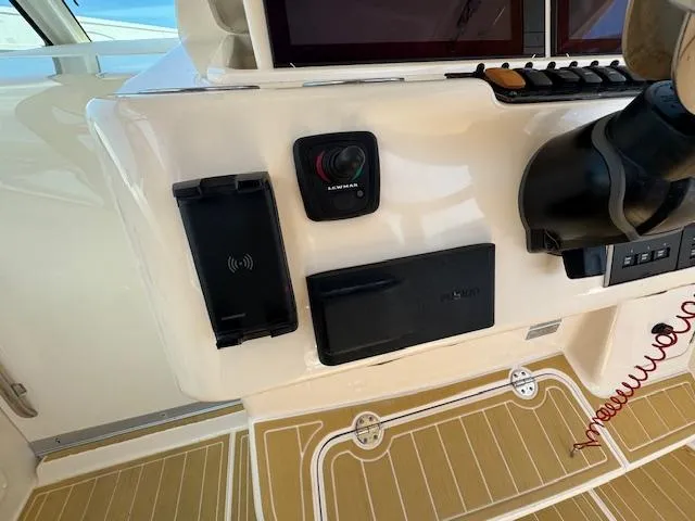 Slide: The Image of Control panel of 2022 Grady-White Express 370 boat with modern navigation equipment. - 17