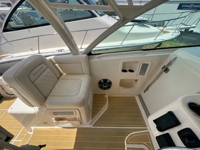 Slide: The Image of 2022 Grady-White Express 370 boat interior with cushioned seating and teak flooring. - 21