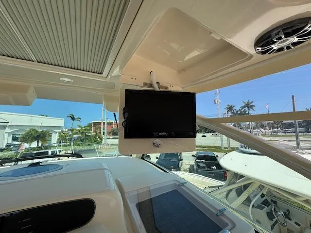 Slide: The Image of 2022 Grady-White Express 370 boat interior with mounted screen and speaker system. - 23