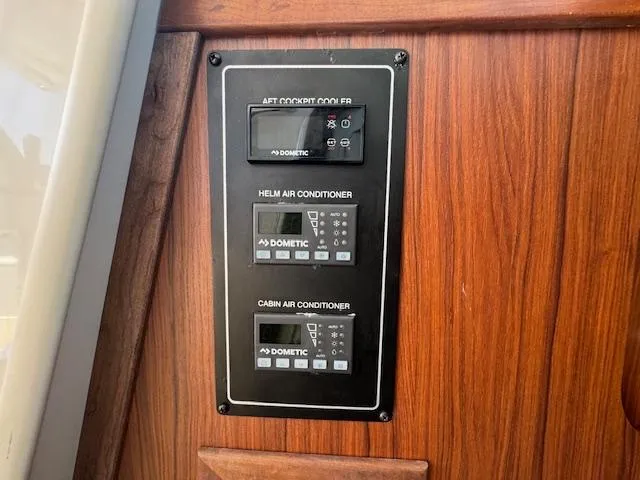 Slide: The Image of Control panel for air conditioning on 2022 Grady-White Express 370 boat. - 29