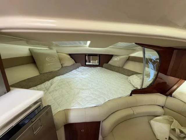 Slide: The Image of Luxurious cabin interior of 2022 Grady-White Express 370 boat with cozy bedding. - 30
