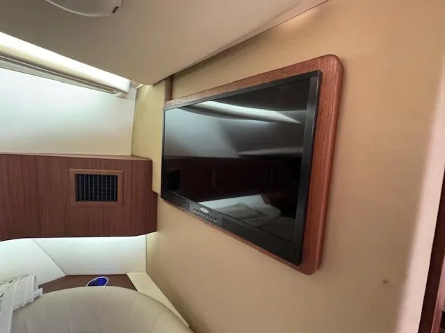 Slide: The Image of Interior of 2022 Grady-White Express 370 with mounted flat-screen TV. - 32