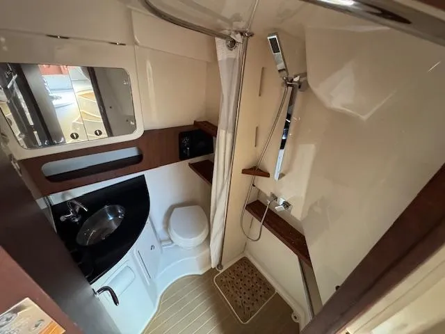 Slide: The Image of 2022 Grady-White Express 370 boat bathroom with shower, sink, and toilet. - 36