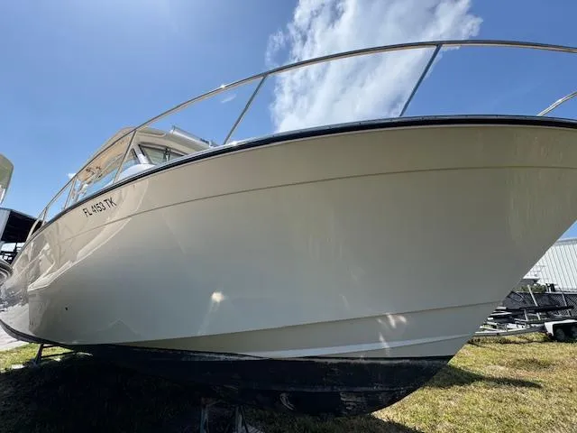 Slide: The Image of 2022 Grady-White Express 370 boat on grass under clear blue sky. - 5