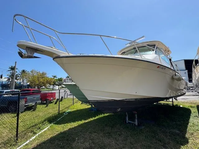 Slide: The Image of 2022 Grady-White Express 370 boat on display outdoors, sunny day. - 7