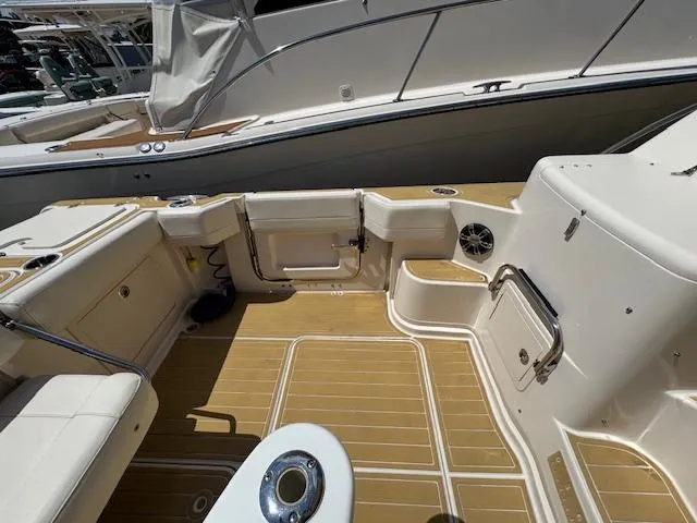 Slide: The Image of 2022 Grady-White Express 370 boat deck with seating and storage compartments. - 9