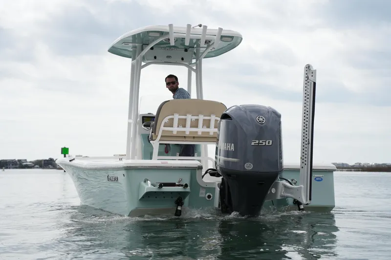Slide: The Image of 2021 Tidewater 2210 Carolina Bay boat with Yamaha 250 engine on water. - 10