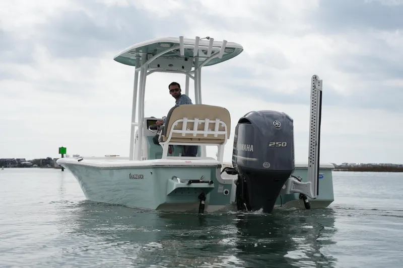Slide: The Image of 2021 Tidewater 2210 Carolina Bay boat with Yamaha 250 engine on calm water. - 13