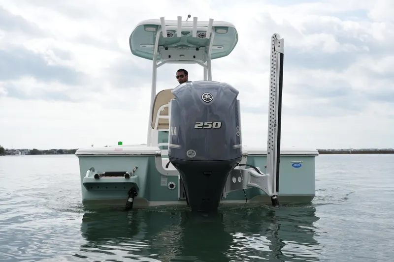 Slide: The Image of 2021 Tidewater 2210 Carolina Bay boat with Yamaha 250 engine on calm water. - 14