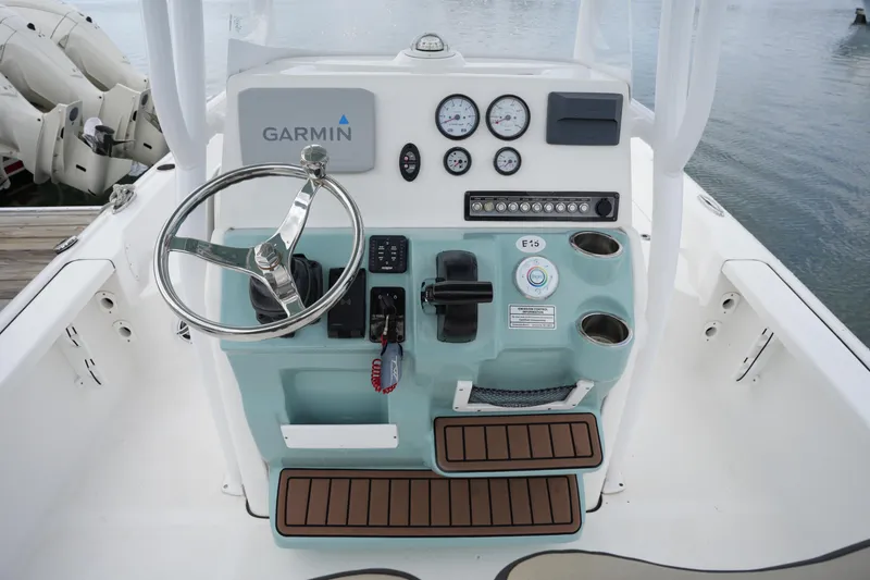 Slide: The Image of 2021 Tidewater 2210 Carolina Bay boat console with Garmin navigation and gauges. - 21