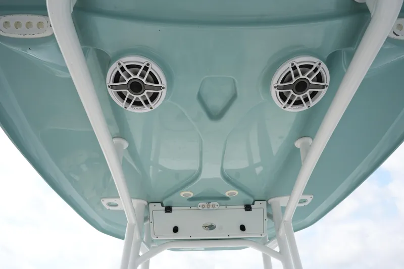 Slide: The Image of 2021 Tidewater 2210 Carolina Bay boat underside with speakers and white framework. - 23