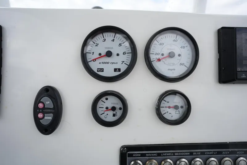 Slide: The Image of Instrument panel of a 2021 Tidewater 2210 Carolina Bay boat with gauges and controls. - 26