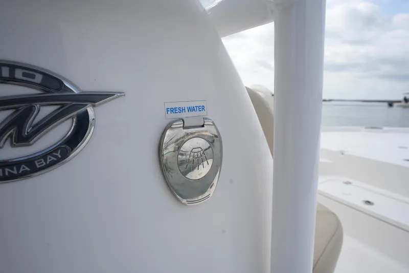 Slide: The Image of Tidewater 2210 Carolina Bay 2021 boat with fresh water access feature. - 31