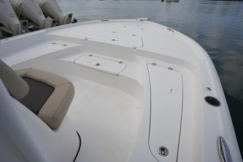 Slide: The Image of 2021 Tidewater 2210 Carolina Bay boat deck with storage compartments and seating. - 32