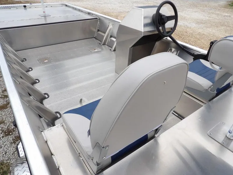 Slide: The Image of 2025 Blazer 1752 SC boat interior with steering console and seating. - 11