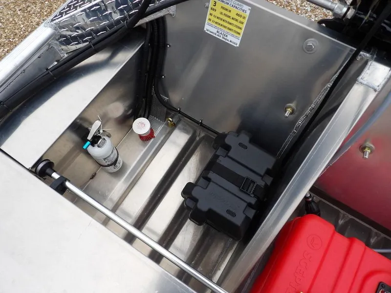 Slide: The Image of Interior of 2025 Blazer 1752 SC boat showing storage compartment with equipment. - 13