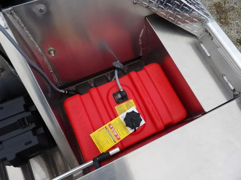 Slide: The Image of Red fuel tank in a 2025 Blazer 1752 SC boat compartment. - 14
