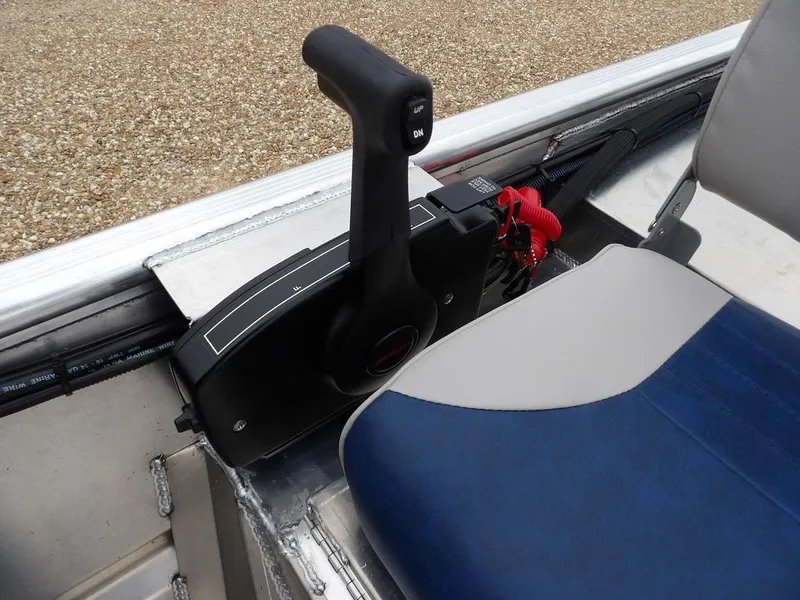 Slide: The Image of 2025 Blazer 1752 SC boat throttle control and seat detail. - 17
