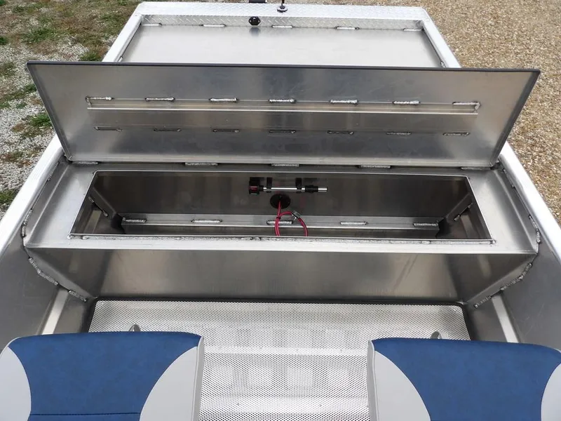 Slide: The Image of 2025 Blazer 1752 SC boat storage compartment with open lid, showcasing interior space and seating. - 27